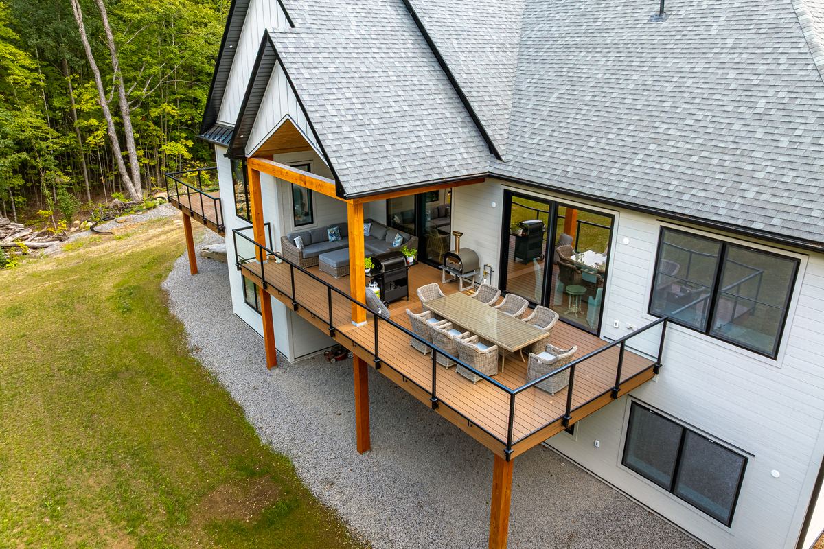 Aerial view of the covered rear deck and outdoor dining area