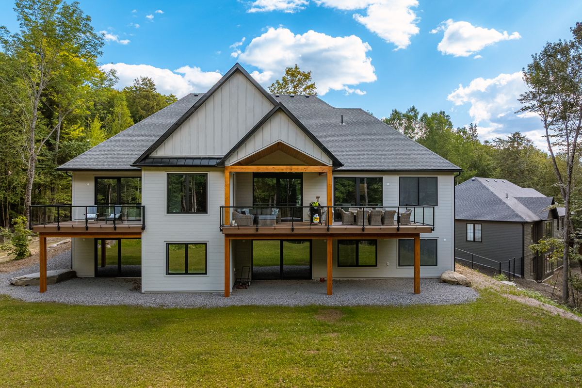 Rear elevation showing the walkout lower level and decks