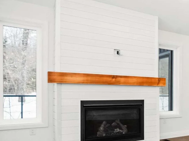 Shiplap fireplace surround with a fir beam mantle, a Fuller Developments standard