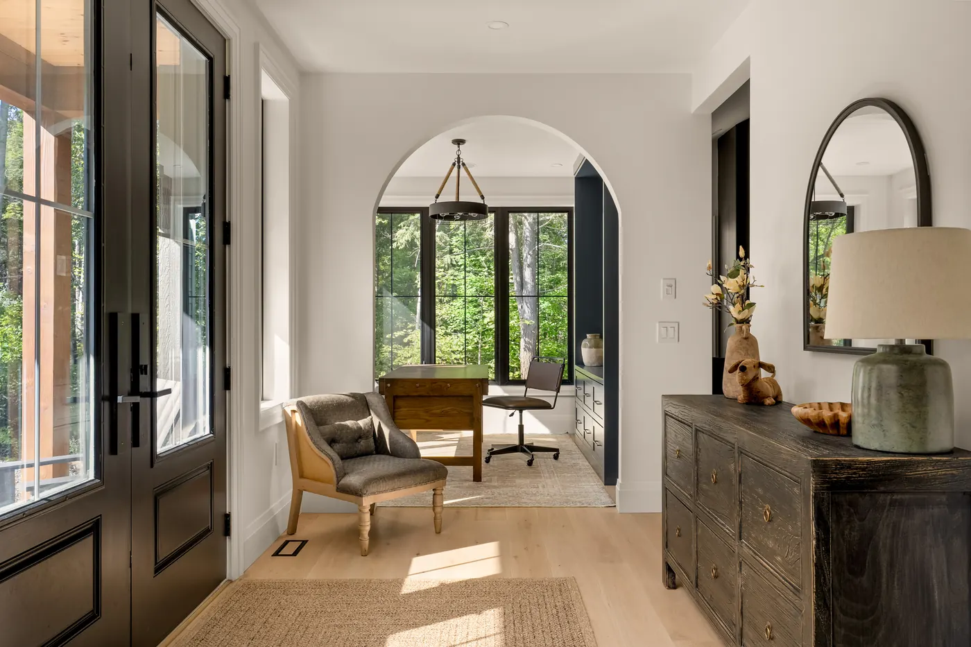 Front entry, double doors with an arched opening to the office in the Fuller model home, 9 Glen Eagle Court