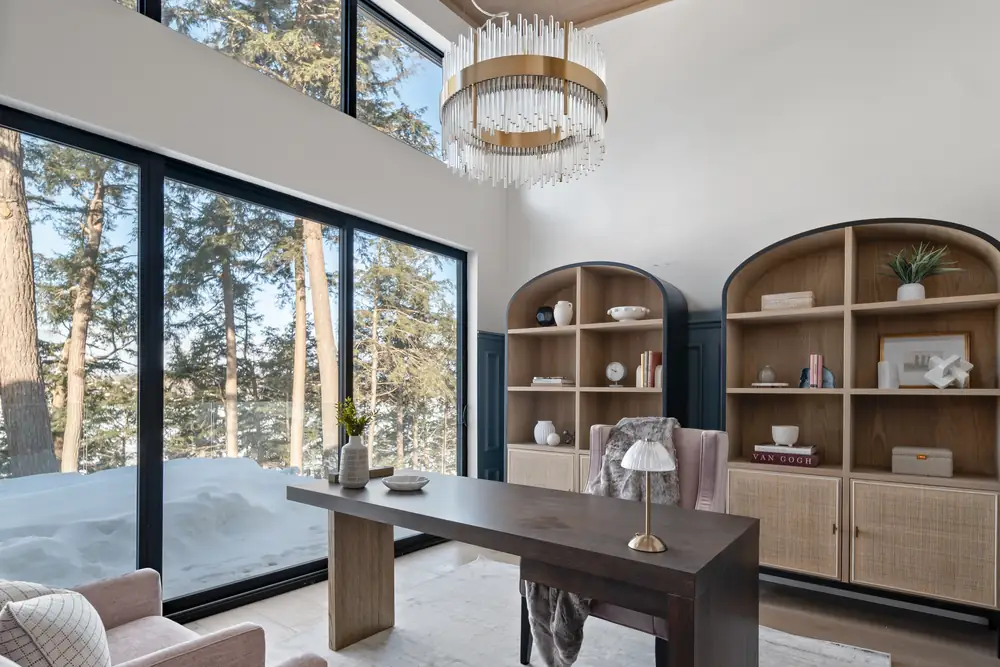 Study at Hemlock Point with arched oak built-ins and floor to ceiling glass facing the lake